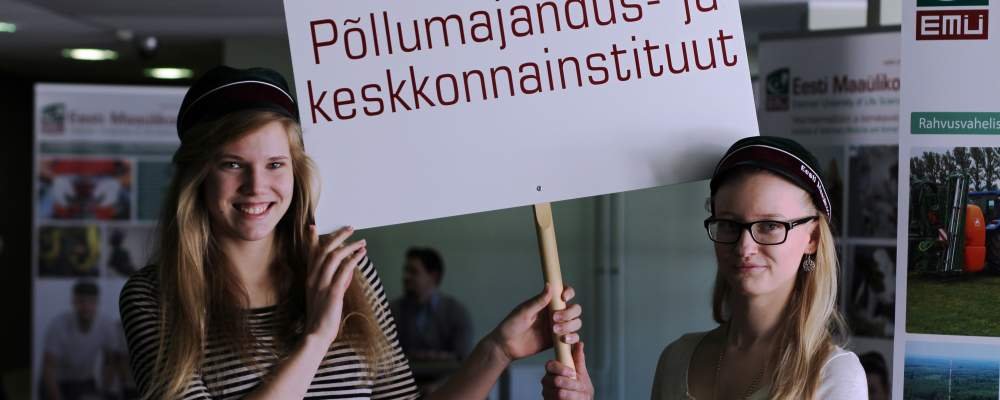 Students of Estonian University of Life Sciences holding the banner of Estonian University of Life Sciences